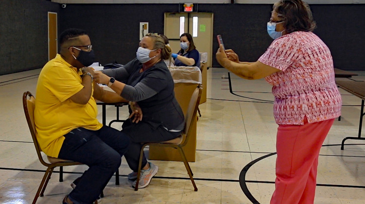 Archie Thomas's mother, Elizabeth, takes a picture of the big moment. - Steve Burger/WNIN