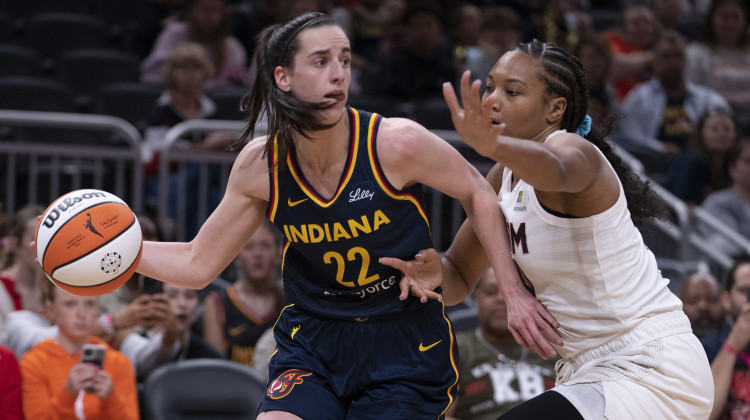 Raucous crowd roars its approval for Caitlin Clark in her home debut with Fever, an 83-80 win