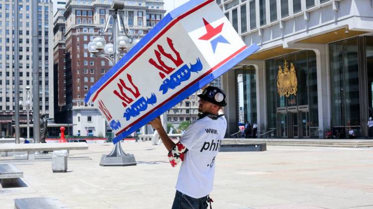 Bernie Sanders supporter and organizer Billy Taylor held a coffin painted with donkeys during a march Sunday in Philadelphia. He told NPR he applied for protest permits to "stop any Hillary supporters from obtaining permits."