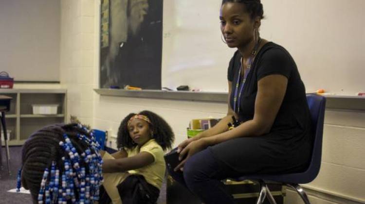 Ayana Coles, right, sits with students at Eagle Creek Elementary School. At Eagle Creek, students of color make up 77 percent of the student body, and all but four of the school’s 37 staff are white. Coles has led conversations about race with colleagues throughout the year. - Peter Balonon-Rosen/Indiana Public Broadcasting