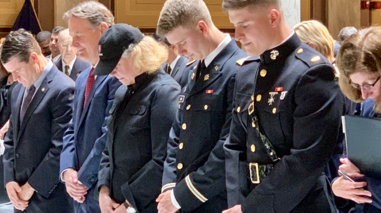 Evan Bayh, second from left, with his wife Susan and sons Nick and Beau at the Statehouse memorial for Evan's father, Birch Bayh. - Brandon Smith/IPB News