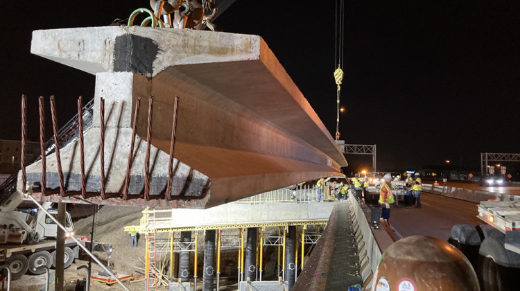 In this photo taken in April crews set a beam for a bridge over St. Clair Street in downtown Indianapolis as part of the North Split Project. - Provided by Indiana Department of Transportation