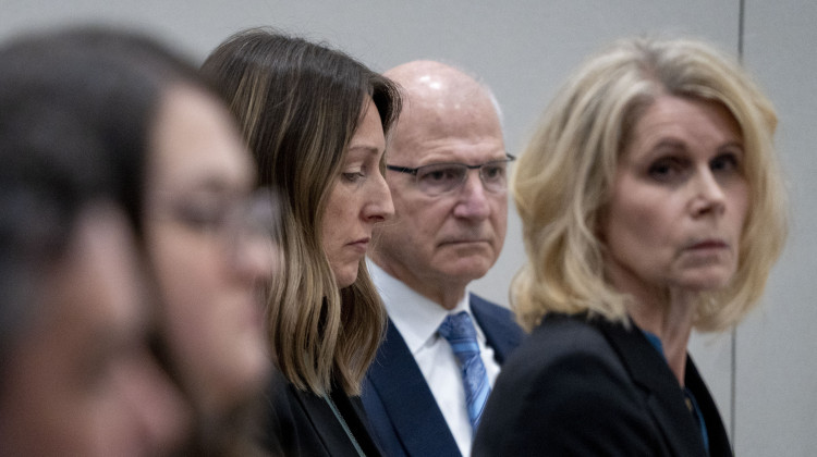 Dr. Caitlin Bernard (center left) sits next to her attorneys during a May 25 hearing before the Indiana Medical Licensing Board in downtown Indianapolis. - Mykal McEldowney / The Indianapolis Star via AP