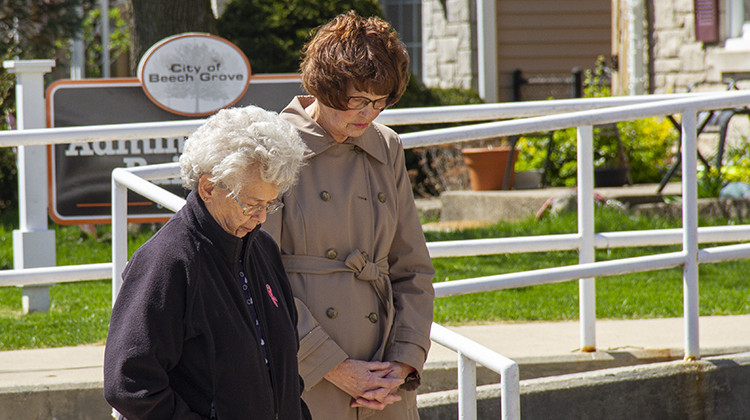 Beech Grove residents, faith leaders and city officials gathered outside City Hall on Saturday to mark the one year anniversary of the FedEx shooting. - Doug Jaggers/WFYI