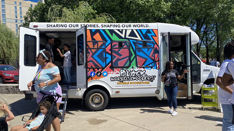 The fully renovated Black Worldschoolers Mobile Bookstore is parked at the 2022 Juneteenth celebration at White River State Park. - Elizabeth Gabriel/WFYI