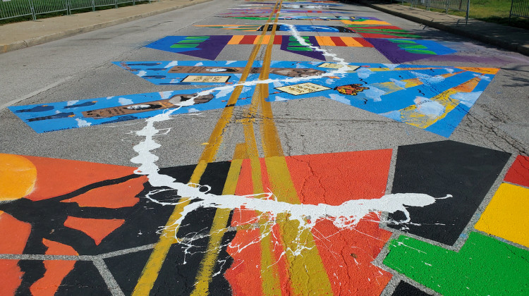 Paint splatter on the Black Lives Matter mural on Indiana Avenue between between the Indianapolis Urban League and the Madam Walker Legacy Center on Sunday, Aug. 8. 2020. - WFYI News