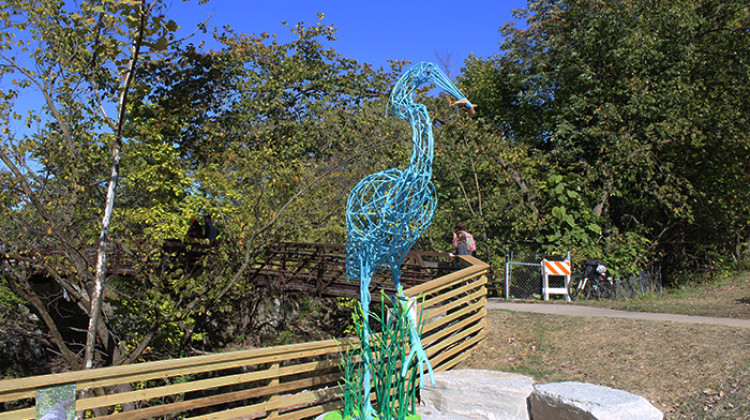 A new sculpture of a blue heron will greet passersby as they cross the Spruce Street bridge near Pleasant Run creek. - Erica Irish/WFYI