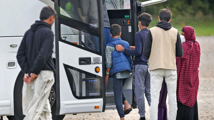Afghan evacuees board a bus at Camp Atterbury. Indiana's resettlement organizations are expecting to settle 600 to 700 people, though they might not be from Camp Atterbury. - Kelly Wilkinson/Indianapolis Star