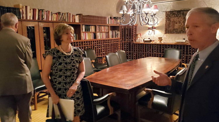 Head of Purdue's Department of Food Science Brian Farkas gives USAID Deputy Administrator Bonnie Glick a tour of the university's facilities including the Richard P. Vine Enology Library, home to hundreds of bottles of wine. - Samantha Horton/IPB News