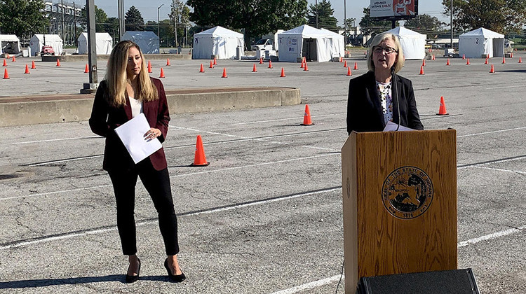 State Health Commissioner Dr. Kris Box (at lectern) and Department of Health Chief Medical Officer Dr. Lindsay Weaver say vaccines are the ultimate answer to ending the pandemic.  - Brandon Smith/IPB News
