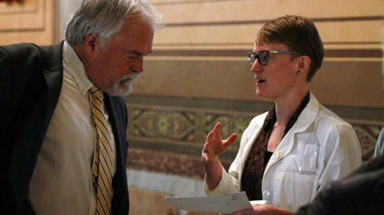 Rep. Brad Barrett (R-Richmond) listens as Dr. Alison Case delivers a letter signed by more than 200 health care professionals, asking him to halt Senate Bill 480. - Brandon Smith/IPB News
