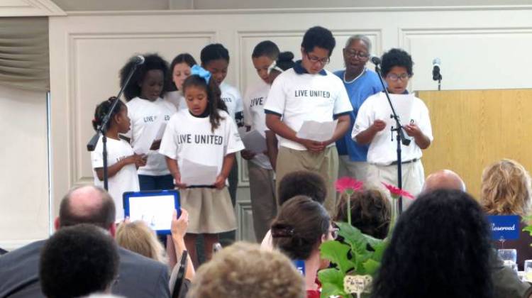 Bridges to Success coordinator Liz Odle and IPS students thank school volunteers and principals at a June celebration honoring the program. - Hayleigh Colombo/Chalkbeat