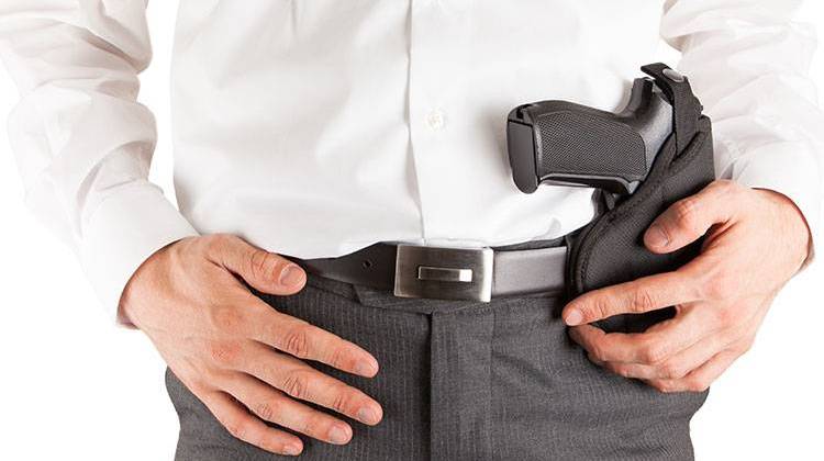 A bill giving Statehouse staff members permission to carry handguns passed a Senate committee Wednesday. - stock photo