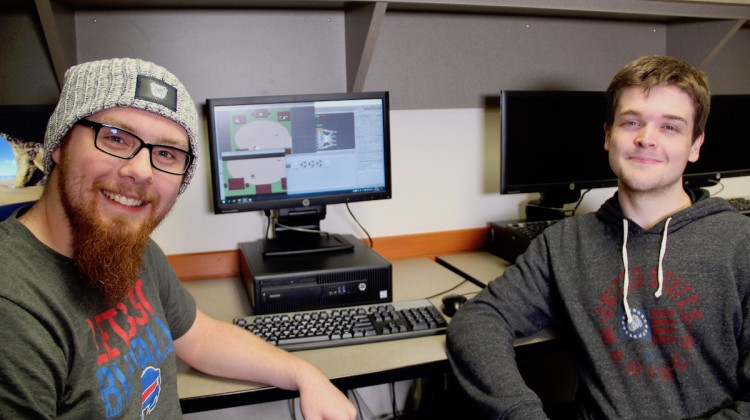Butler University students Mathew O'Hern, left, and Parker Winters, right, are developing a video game to assist children with autism improve social skills. - Provided by Butler University