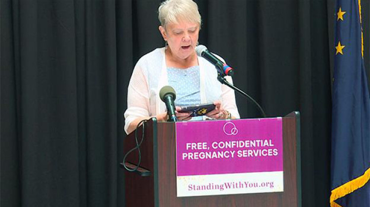 Anti-abortion activist Cathie Humbarger speaks at the Statehouse Monday before the start of the special legislative session. - Mitch Legan, WTIU/WFIU News