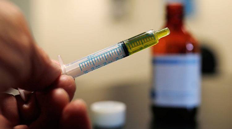 FILE - In this Nov. 6, 2017, file photo, a syringe loaded with a dose of CBD oil is shown in a research laboratory at Colorado State University. - AP Photo/David Zalubowski, File