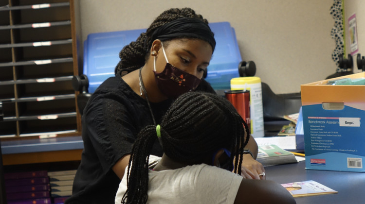 A MSD Wayne Township Schools teachers works with a student in August 2020. - Eric Weddle/WFYI