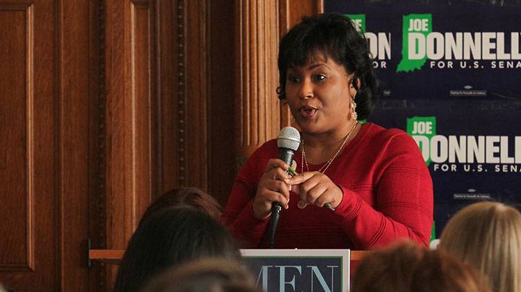 Rep. Cherrish Pryor (D-Indianapolis) shares her experiences with U.S. Sen. Joe Donnelly with a crowd in Indianapolis. - Lauren Chapman/IPB News