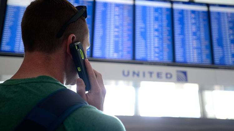 Dennis McCormack of Rockaway, N.J. checks the departure board only to find out that his flight to Newark, N.J. has been canceled at O'Hare International Airport. All flights in and out of Chicago's two airports were haltedafter a fire at a suburban air traffic control facility sent delays and cancellations rippling through the U.S. air travel network. - AP Photo/Paul Beaty