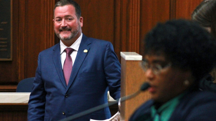 Rep. Chuck Goodrich (R-Noblesville), left, looks on as Rep. Cherrish Pryor (D-Indianapolis) speaks on the House floor on Monday, Feb. 7, 2023, about their bill to increase the state's earned income tax credit. - Brandon Smith/IPB News