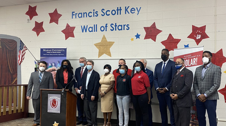 Mayor Joe Hogsett, Marian University President Dan Elsner, Indianapolis Public Schools Superintendent Aleesia Johnson and other education leaders stand inside PLA @ School 103 on Thursday after announcing a new federally funded program to support 3,700 students on the Far Eastside. - (Elizabeth Gabriel/WFYI)