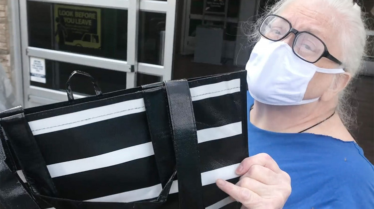 Clare Skeehan holds up her reusable bag she was unable to use on her grocery shopping trip. - Alan Mbathi/IPB News