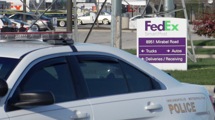Indianapolis police restrict access to the FedEx facility where eight people were shot and killed by a former employee. - Alan Mbathi/IPB News