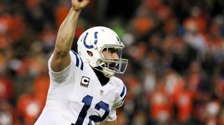 Indianapolis Colts quarterback Andrew Luck celebrates a touchdown pass against the Denver Broncos during the second half of an NFL divisional playoff football game, Sunday, Jan. 11, 2015, in Denver. - Associated Press photo