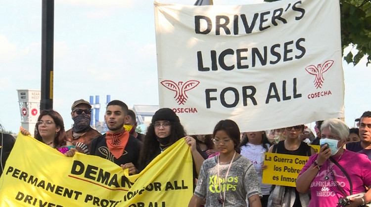 embers of Movimiento Cosecha Indiana march along the White River in Indianapolis, demanding driver's licenses for undocumented Hoosiers. - Lauren Chapman/IPB News