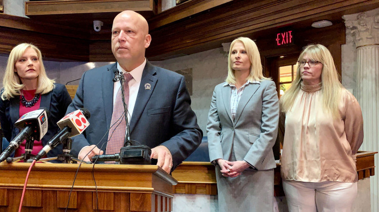 Sen. Mike Crider (R-Greenfield) talks about his legislation with Sen. Erin Houchin (R-Salem), left, and sexual assault prevention advocates supporting him.  - Brandon Smith/IPB News