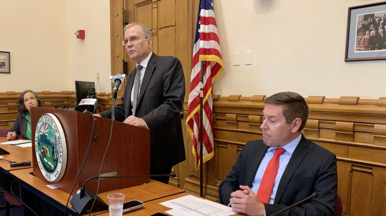 Office of Management and Budget Director Cris Johnston (center) discusses the end of Indiana's 2021 fiscal year, along with State Auditor Tera Klutz (left) and State Budget Director Zac Jackson (right). - Brandon Smith/IPB News