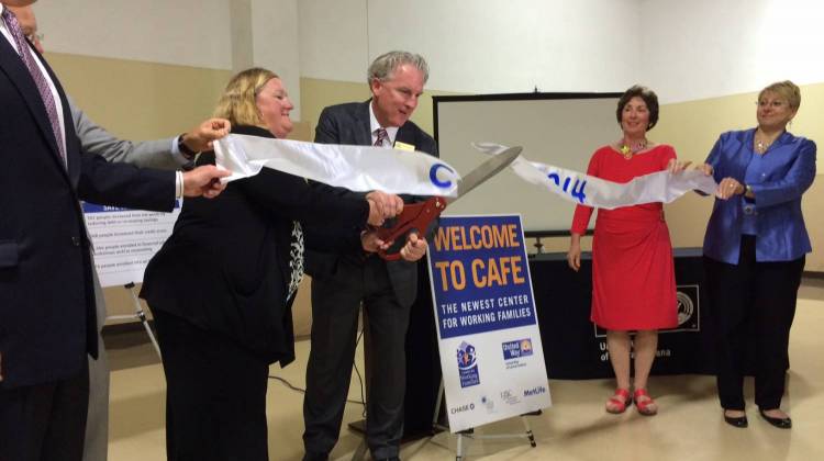 Community organization representatives celebrate the opening of the new Center for Working Families location. - Christopher Ayers/WFYI