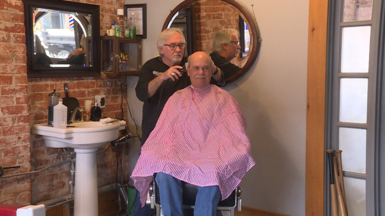Barber Dan Fleener cuts Morgan County Commissioner Kenny Hale's hair at his shop in Martinsville. - Rebecca Thiele/IPB News