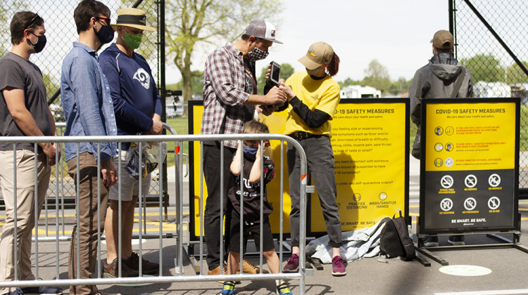 A fan has his ticket scanned to enter the Indianapolis Motor Speedway on Saturday, May 15. - Doug Jaggers/WFYI