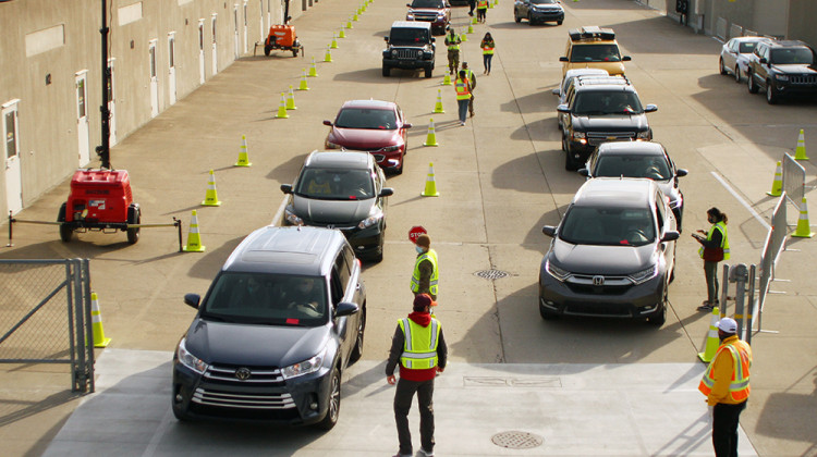 ars lined up at the Indianapolis Motor Speedway Friday for a mass vaccination clinic. Health officials anticipate the four-day clinic will distribute nearly 17,000 Johnson & Johnson singe-dose COVID-19 vaccines.  - Doug Jaggers/WFYI