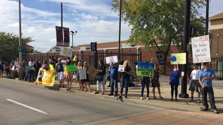 People rally outside the Indiana state fairgrounds during President Donald Trump's speech on tax reform. - Jill Sheridan/IPB News