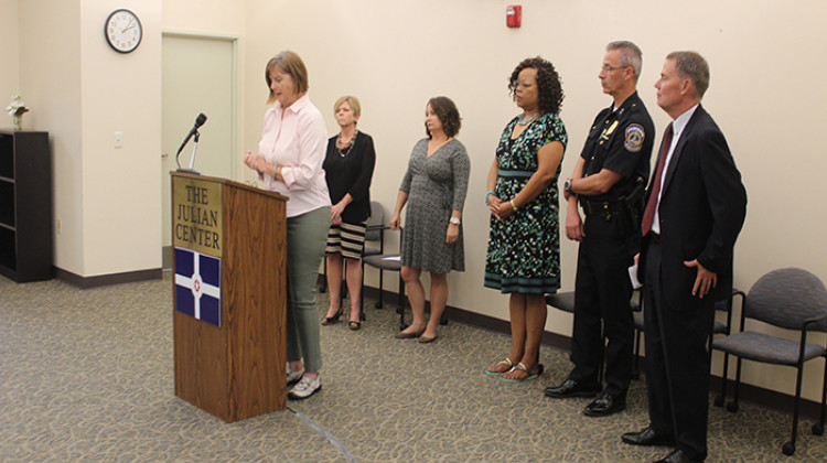 Julian Center CEO Catherine O'Connor speaks alongside city officials. - Erica Irish/WFYI