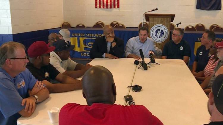 U.S. Sen. Joe Donnelly next to U.S. Rep. Andre Carson at a roundtable discussion on outsourcing with union workers in Indianapolis. (Lauren Chapman/IPB News) - IPBS-RJC
