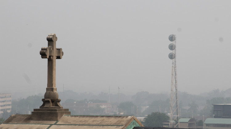 Haze from the wildfires in late June obscured the Indianapolis skyline. The state will experience a combination of ozone pollution, or smog, and smoke from wildfires on Thursday.  - Ben Thorp/WFYI