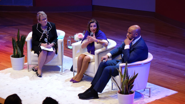 Kim Hood Jacobs read questions for House Speaker Nancy Pelosi (D-CA) and U.S. Rep. André Carson (D-Indianapolis) from audience members. - David Wolfe Bender/WFYI