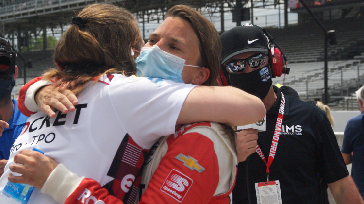 Driver Simona de Silvestro hugs one of her Paretta Autosport teammates after qualifying for the Indianapolis 500. - Samantha Horton/IPB News