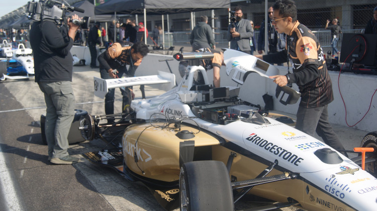 Members of Black & Gold Autonomous Racing make final preparations to the team's car ahead of the Indy Autonomous Challenge at the Indianapolis Motor Speedway in October. - (Samantha Horton/IPB News)