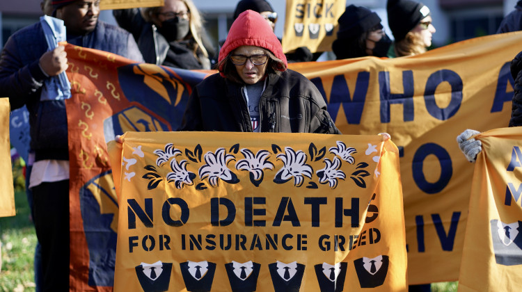 A protester by Elevance Health's headquarters in Indianapolis during a protest organized by the patient advocacy group People's Action on Nov. 14, 2022. - Provided by People's Action