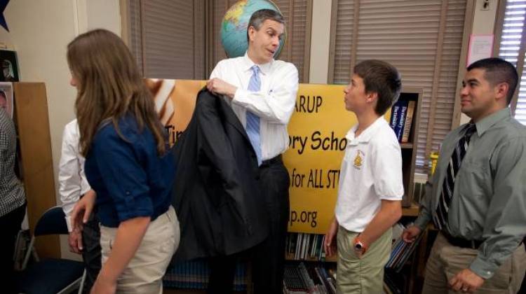 Secretary of Education Arne Duncan talks with students in the library at Tincher Preparatory School in Long Beach, Calif., March 22, 2011. Tincher Preparatory School, a K-8 public school where more than 50 percent of the students are designated as disadvantaged, has been recognized for its gains in test scores. - Official White House Photo by Chuck Kennedy