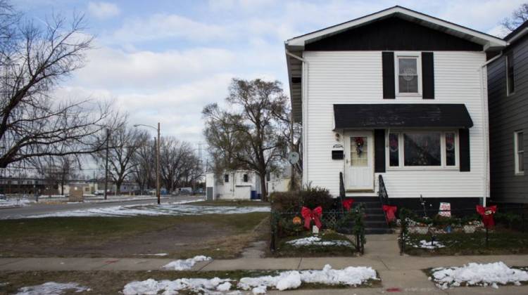 This home in East Chicago sits across the street from a public housing complex, at left, that the city evacuated last year because of lead contamination. - Nick Janzen/IPB News