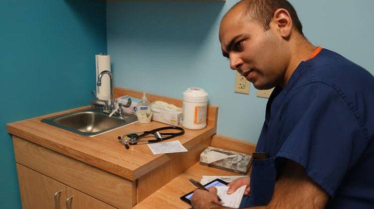 Dr. Jay Joshi's patients uses telemedicine to compliment patients' opioid addiction treatment. - Emily Forman / WFYI