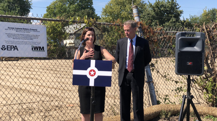 Department of Metropolitan Development Director Emily Mack and Mayor Joe Hogsett announce a $345,000 grant for environmental remediation at the former Colonial Bakery site.  - Darian Benson/WFYI