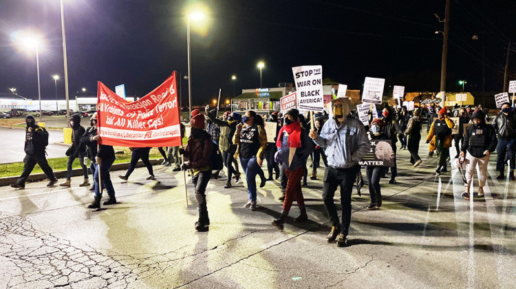 Protesters march along 38th Street on Wednesday, Nov. 11. - Darian Benson/WFYI