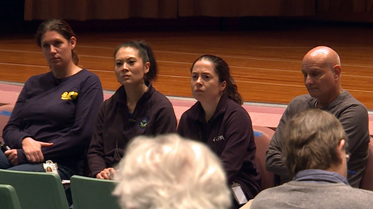 EPA project managers take resident questions at a meeting in the former Carrie Gosch Elementary School in East Chicago's Superfund.  - (Lauren Chapman/IPB News)