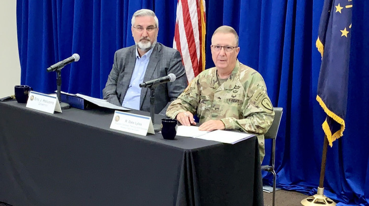 Gov. Eric Holcomb and Maj. Gen. Dale Lyles, head of the Indiana National Guard, discuss details of Afghan evacuees coming to Camp Atterbury in September 2021. - Brandon Smith/IPB News